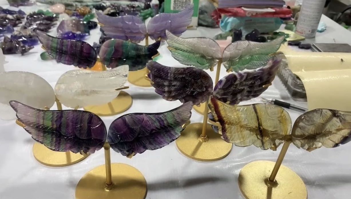 Assorted stone wing one pairs with metal stand