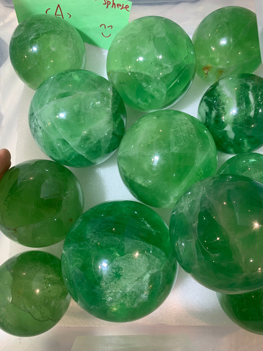 Green fluorite assorted size sphere