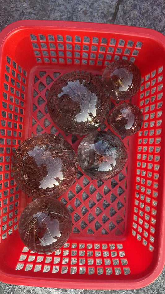 Gold hair rutilated quartz assorted size sphere 1