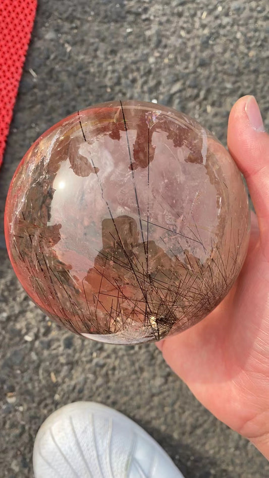 Black hair rutilated quartz sphere 1