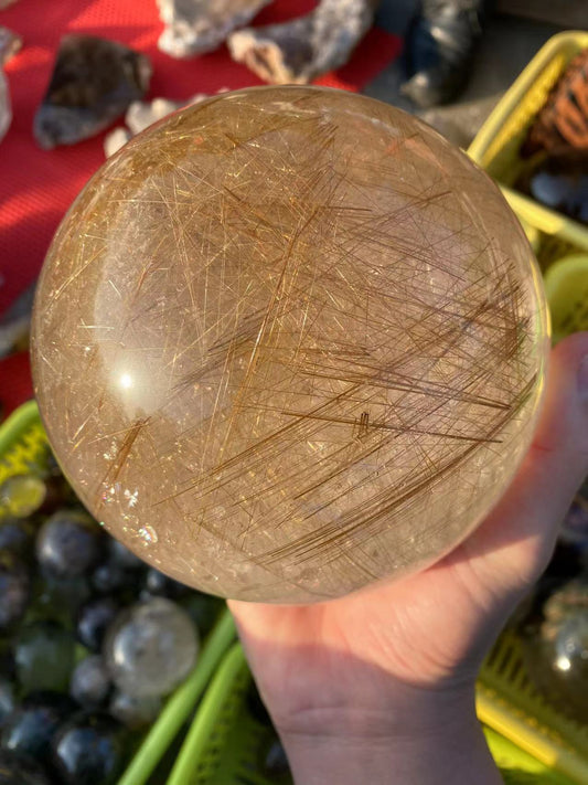 Gold hair rutilated quartz sphere 7