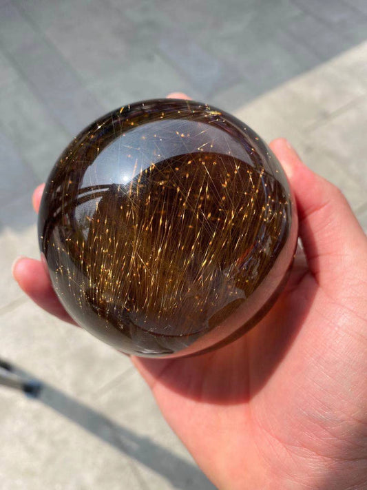 Gold hair rutilated quartz sphere 4