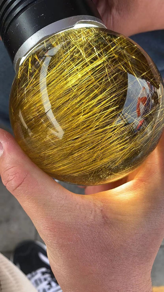 Gold hair rutilated quartz sphere 3